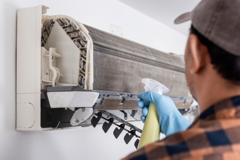 Ac Maintenance Guide: How Can You Keep Your Air Conditioner Running Like New 3 Washing a dusty split AC filter under tap water